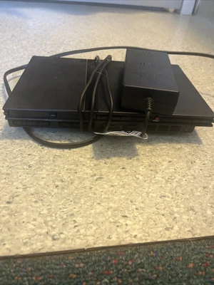 $150 • Buy Sony PlayStation 2 Slim Console - Black With 20 Games And 4 Controllers