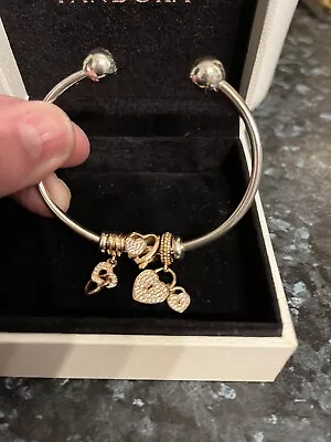 Pandora Bangle With 3 Rose Gold Charms.  • £65