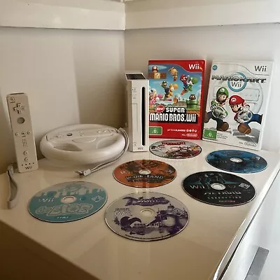 Nintendo Wii Bundle With 8 Games 2 Controllers And Steering Wheel - Cases CIB • $98.50