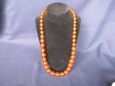 Vintage Amber Lucite Necklace 25.5  Graduated Beads. • $35