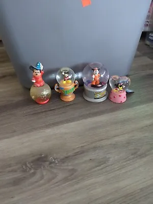 4 Disney Snow Globes  • $9.99