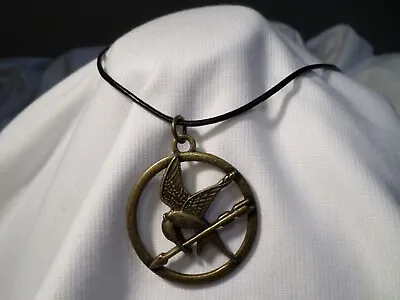 Lions Gate Films Hunger Games Mockingjay Brass Medallion On Black Cord Necklace • $7.50