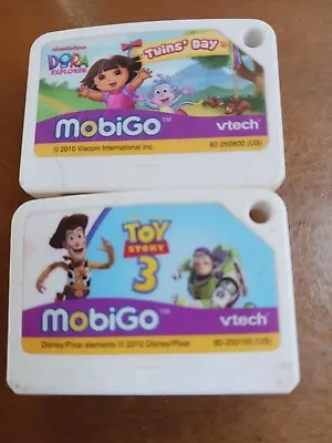 Lot Of 2 Vtech Mobigo Games Dora The Explorer & Toy Story 3 Pleas See Pic's • $14.95