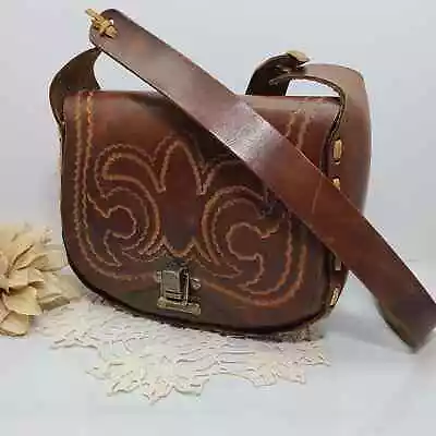 Vintage Hand Tooled Fleur De Lis & Laced 1970's Brown Leather Saddle Bag  • $50