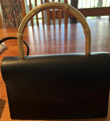 $300 • Buy Grace Oroton Top Handle Clutch.