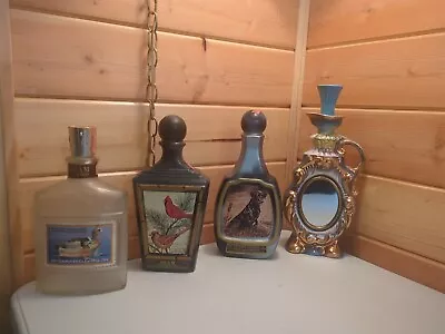 4 Vintage Jim Beam Whiskey Decanter Bottles  • $45