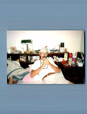 Found Color Photo H+4181 Mustache Man Sitting In Bed Lighting Cigarette • $6.98
