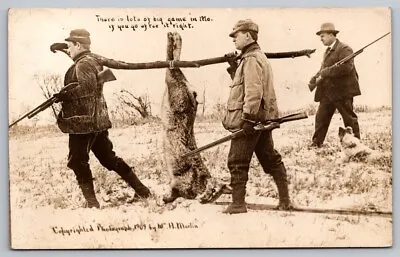 Exaggeration RPPC Postcard Martin Two Hunters Carrying Large Rabbit Big Game Mo. • $8.76