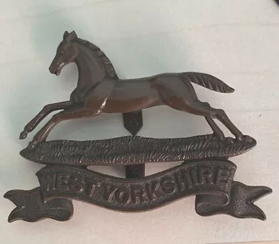 The West Yorkshire Regiment Officers Service Dress Cap Badge. • £18.55