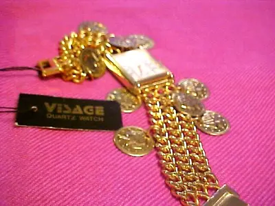 NEW NEVER WORN WITH TAG VISAGE Quartz Ladies Charm Bracelet Style Watch COINS • $24.50