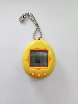 Original 1996 Tamagotchi - Classic Retro Toy - Yellow Orange (Japanese) • $10