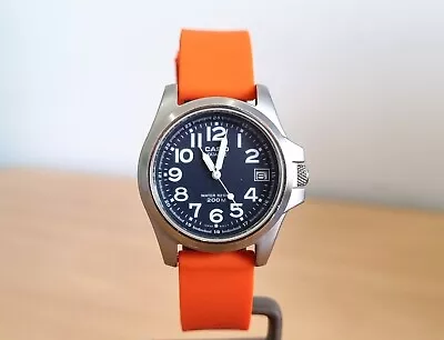 Casio Unisex SS Black Dial Dated Quartz Watch Orange Rubber Strap. • $10