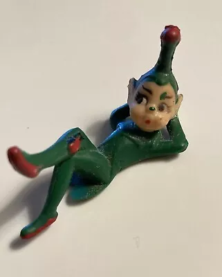 Vintage Green Christmas Elf Pixie Rubber Laying Down Relaxing Figurine  • $8.99