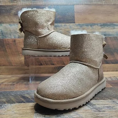 UGG Women's MIni Bailey Bow Sparkle Gold Glitter Boots Size 6 • $98