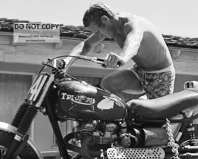 STEVE McQUEEN CRANKING UP TRIUMPH MOTORCYCLE - 8X10 PUBLICITY PHOTO (AB891) • $8.87