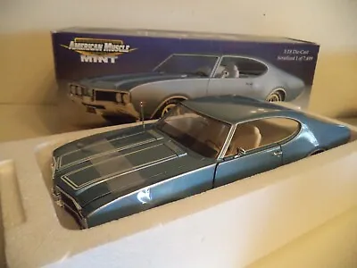 American Muscle  1:18 1969 OLDS CUTLASS 442 W32    1/18 SCALE   IN BOX. • $79.99