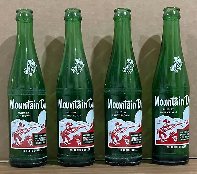 Lot Of 4 Vintage Mountain Dew Bottles W/ Unique Names Under The Word “Mountain” • $30