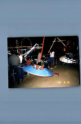 Found Color Photo G+6280 Boy Sitting In Flying Saucer Amusement Ride • $6.98