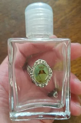 Vintage Glass HOLY WATER Bottle Small Jesus? Emblem  • $5