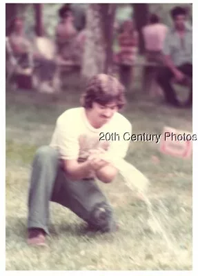 Found Color Photo J+8067 Mustache Man Kneeling Holding Water Balloon • $6.98