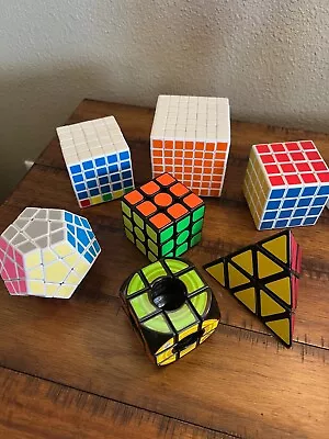 Lot Of 7 Puzzle Cubes: 3x3 4x4 5x5 7x7 Rubiks Void Megaminx & Pyramid • $49.99