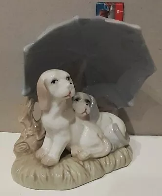 Porcelain Dogs Laying Under Umbrella  • $0.01