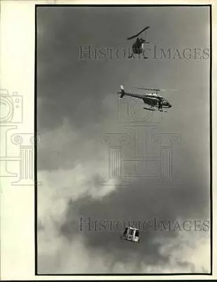 1984 Press Photo Helicopter Stunt Gondola Drop For  French Quarter Undercover  • $15.99