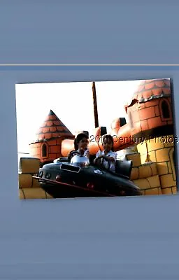 Found Color Photo K+1062 Girls Sitting On Flying Saucer Amusement Ride • $3.98