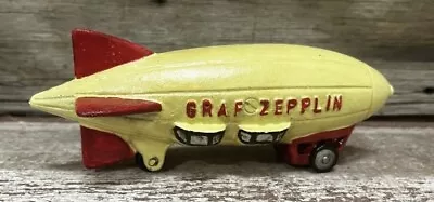 Graf Zepplin Yellow Cast Iron Vintage Blimp Toy On Rolling Wheels • $53.30