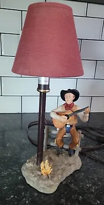 Vintage Cowboy Lamp Sitting On A Fence Playing Guitar Tip Of Guitar Missing  • $26