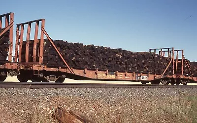 C: Original Slide DMIR Missabe 50' MofW Flat Car W/Tie Load #6345 - Fens MN 1985 • $3.75