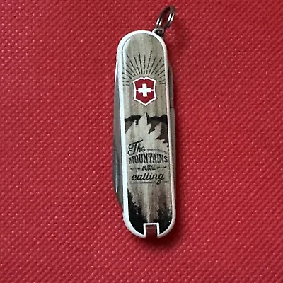 VICTORINOX CLASSIC-MOUNTAINS ARE CALLING-LIMITED EDITION-SWISS ARMY KNIFE- Nice! • $48.98