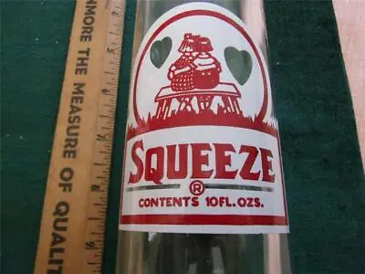 Vintage Squeeze 10 Oz. Soda Bottle - Red On White Label • $16