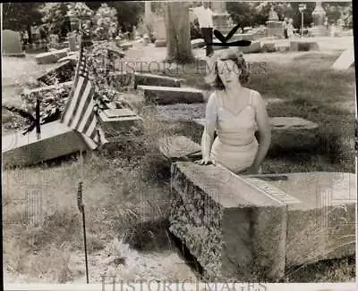 1957 Press Photo Joyce Nee Looks At Overturned Gravestone Mt. Calvary Cemetery • $19.99