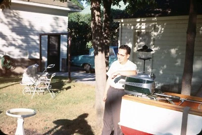 $24.84 • Buy Man Standing Wooden Boat Mercury Outboard Motor In Yard 1960s Vintage 35mm Slide
