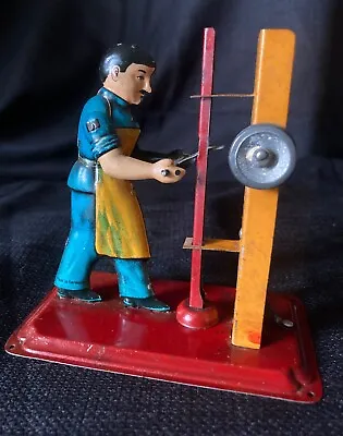 Vintage ARNOLD Steam Powered Grinding Stone Worker Litho Tin Toy • $58.75