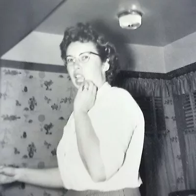 Vintage Black And White Photo Young Woman Scratching Cheek Chin Kitchen Snapshot • $6.69
