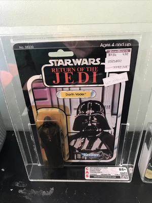 $950 • Buy ‘83 Star Wars: Darth Vader (CAS Graded 85) & ‘95 Farmer Boy Luke (AFA Graded 85)
