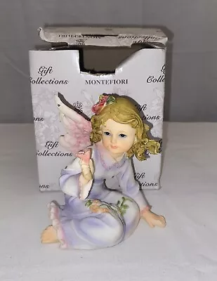 MONTEFIORI COLLECTION Sitting Angel Girl  Holding Flower • $19.95