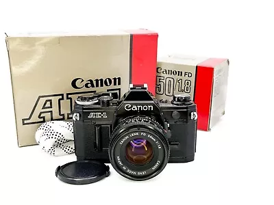 Canon AE-1 35mm SLR Film Camera In Black + FD 50mm F/1.8 Lens + Boxed + Extras • £239.99