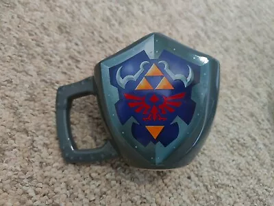 Official Nintendo Legend Of Zelda Mug - Hylian Shield - Grey  • $30