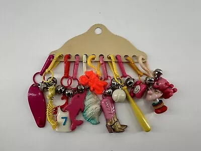 CARDED 1980’s BELL CLIP CHARMS FOR NECKLACES 11 PLASTIC TOY NECKLACE CHARMS 80s • $50