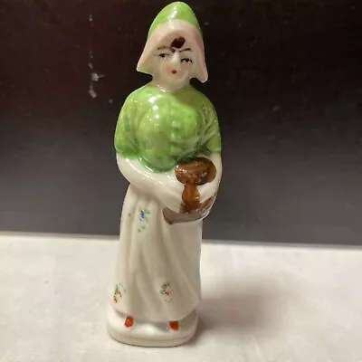  Made In Occupied Japan Girl Holding Basket Green White Floral Dress Figurine  • $9.99