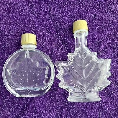 Lot Of 2 Maple Leaf Shaped Bottles Empty Syrup Small Clear Glass Embossed W/Lids • $9.99