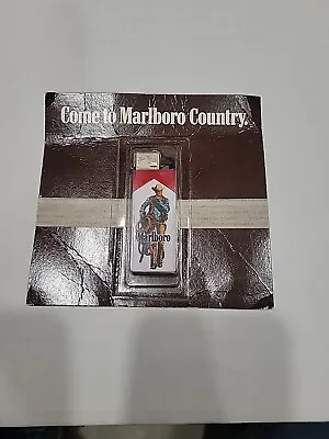 Vintage Marlboro Cigarettes Disposable Lighter Cowboy Carrying A Saddle NOS • $36