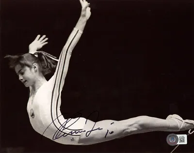 NADIA COMANECI SIGNED 8x10 PHOTO + 10 OLYMPIC GYMNASTICS LEGEND ICON BECKETT BAS • $115