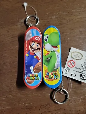 Qty: 2 Super Mario 2015 Blue. Red Mini Plastic Skateboard Keychains • $14.99