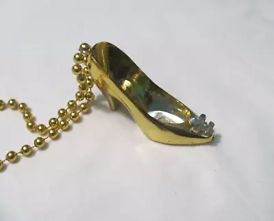 Metallic Gold Mardi Gras Bead W/ A Plastic Shoe W/ Yellow Fleur De Lis • $3.99