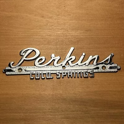 Vintage PERKINS COLORADO SPRINGS Dealership Emblem Car Dealer Badge Metal Trim • $50