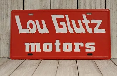 Lou Glutz Motors License Plate Tin Sign Vacation Movie Prop Chevy Chase  • $10.97